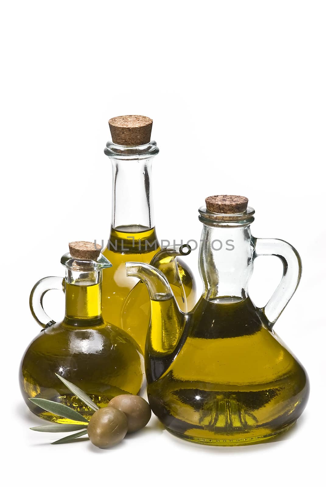 Olive oil bottles and olives isolated on a white background.