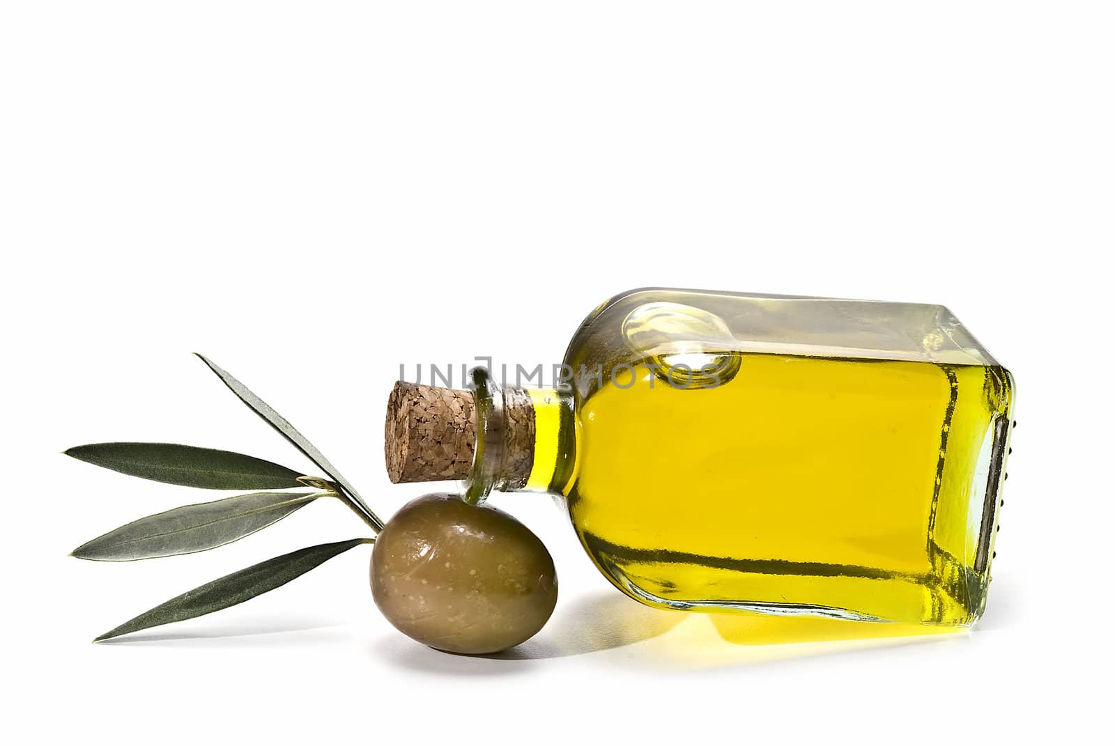 Olive oil bottles and olives isolated on a white background.