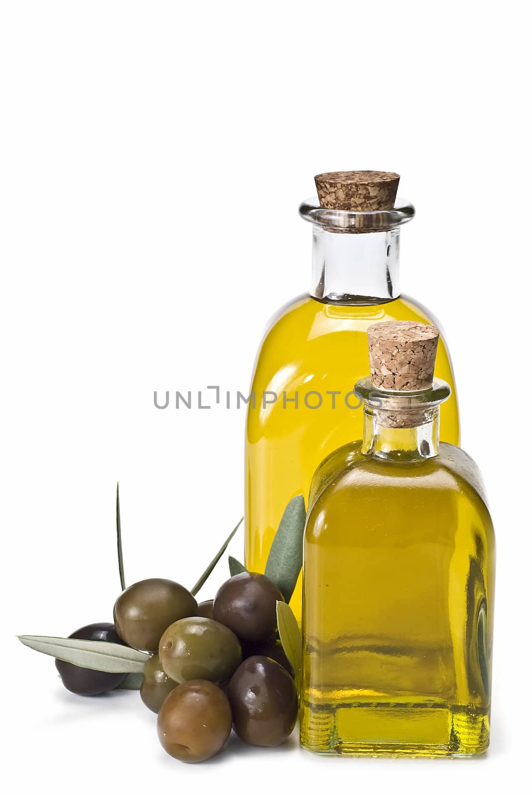 Olive oil bottles and olives isolated on a white background.