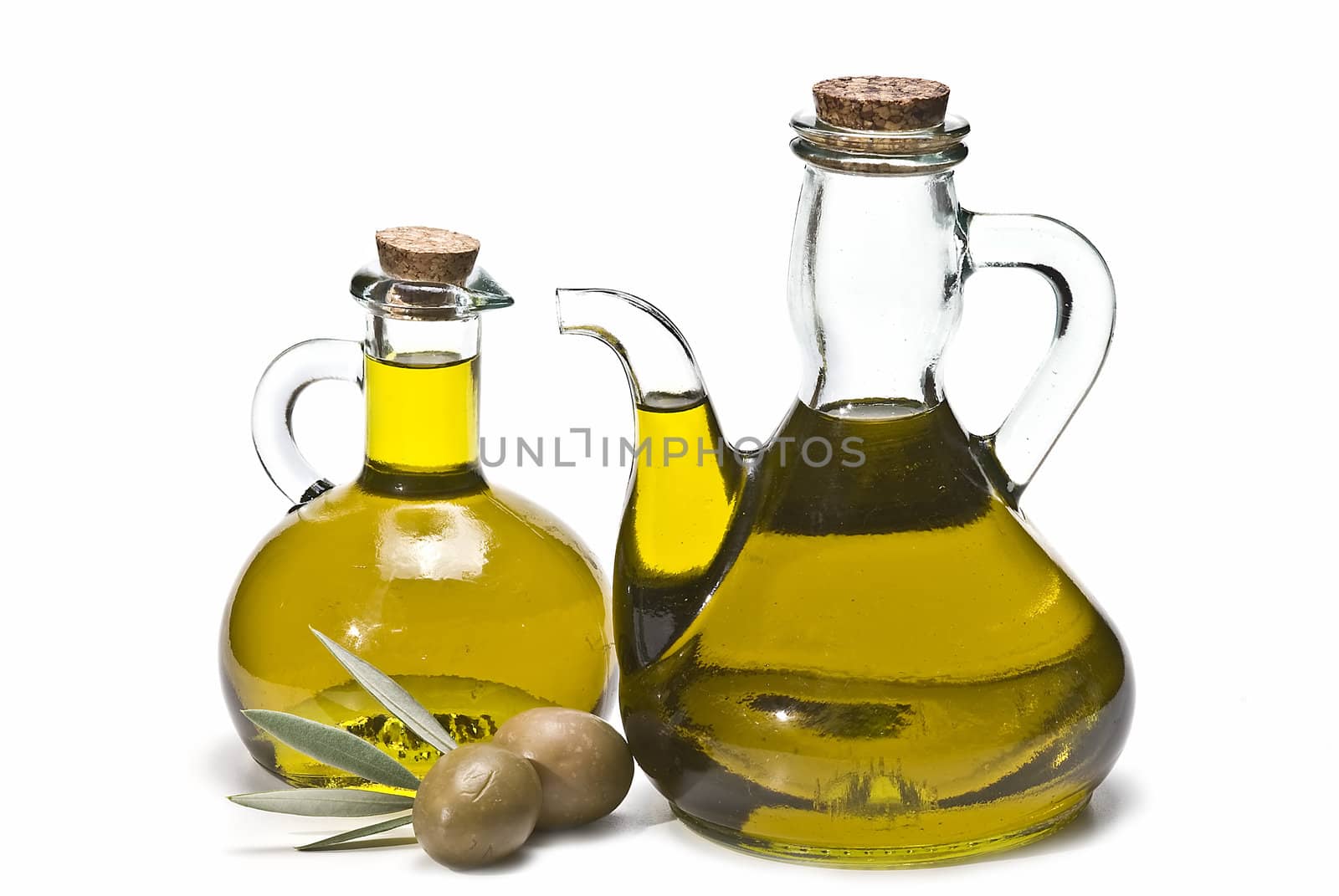 Olive oil bottles and olives isolated on a white background.