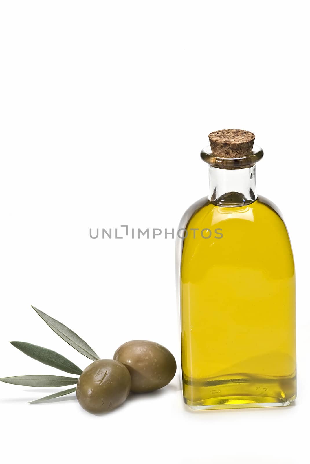 Olive oil bottles and olives isolated on a white background.