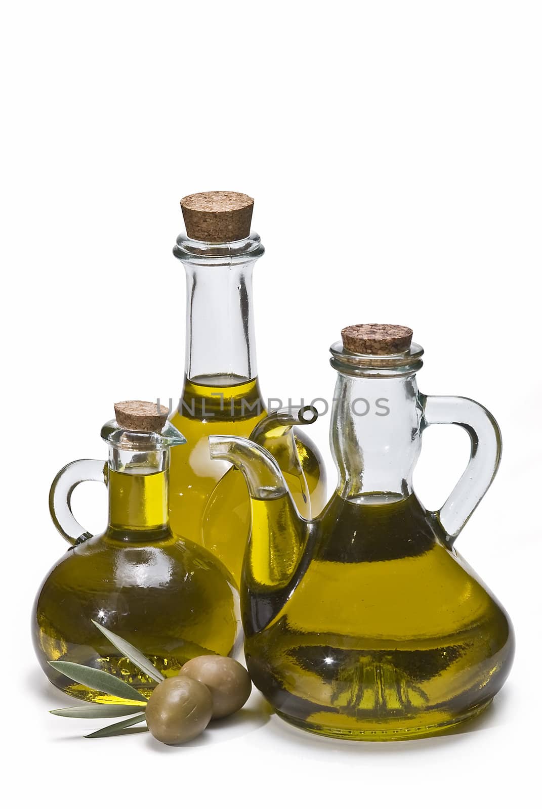 Olive oil bottles and olives isolated on a white background.