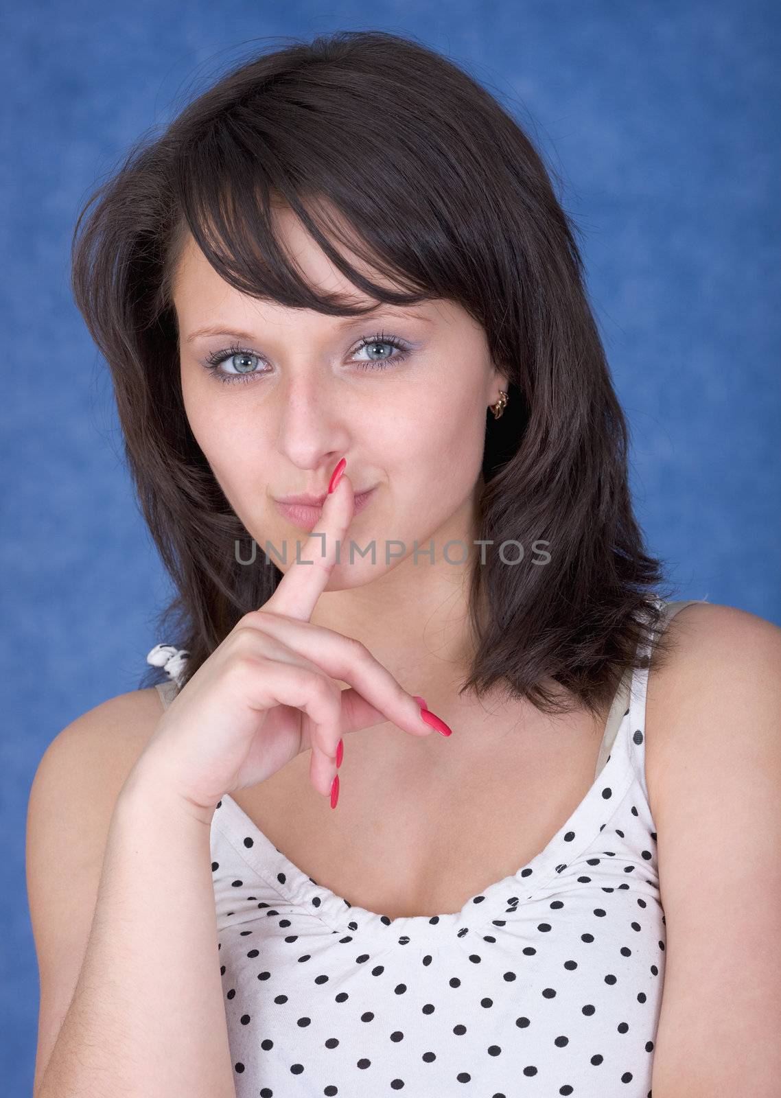 The mysterious girl with a finger near lips