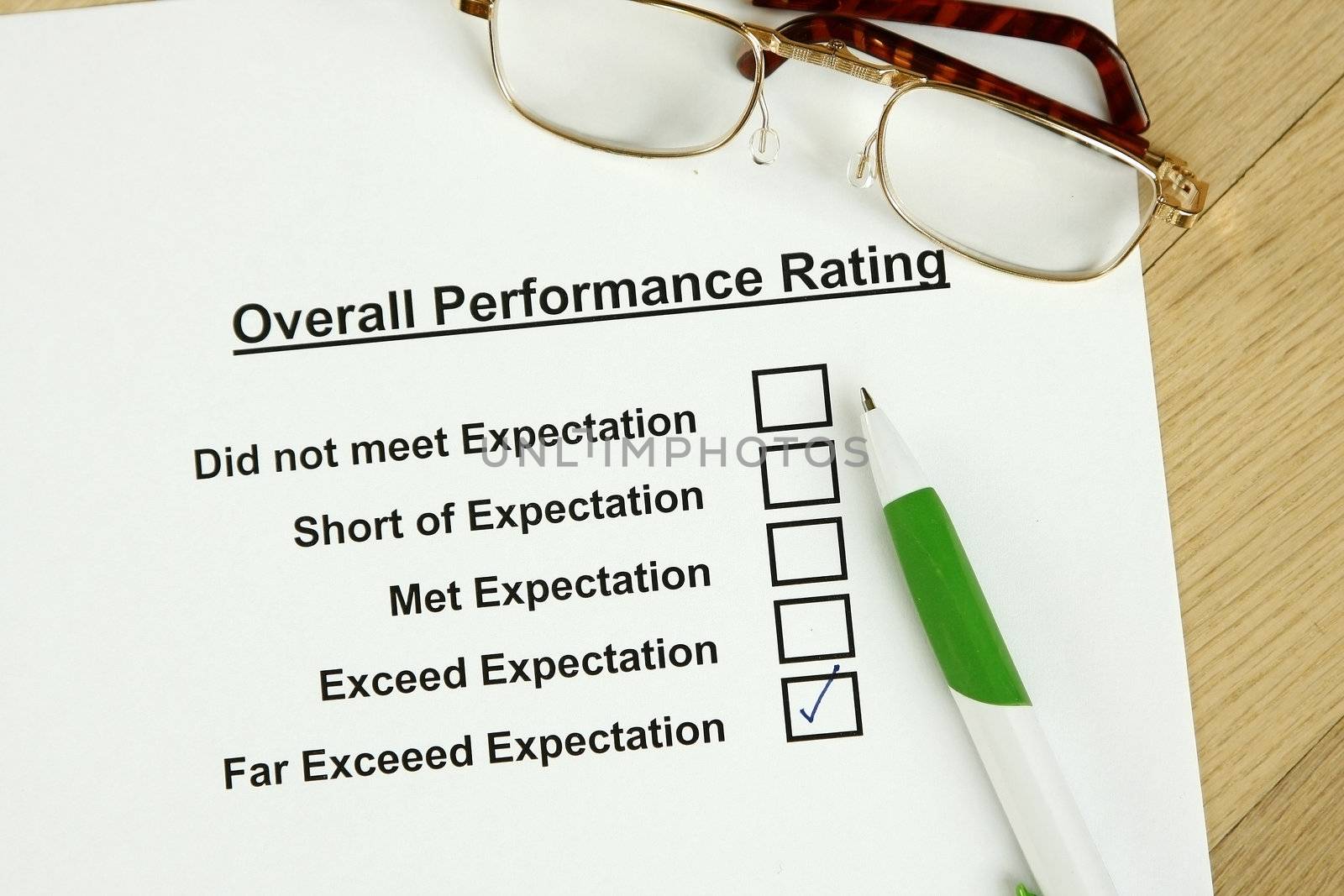 This is an image of an employee performance evaluation and a pair of glasses.