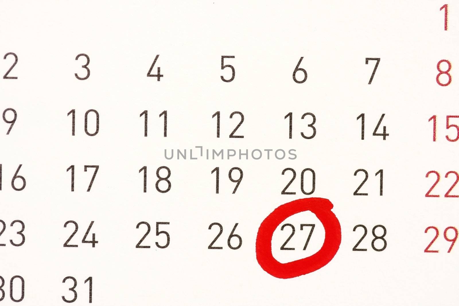 A date circled on a calendar with red ink.
