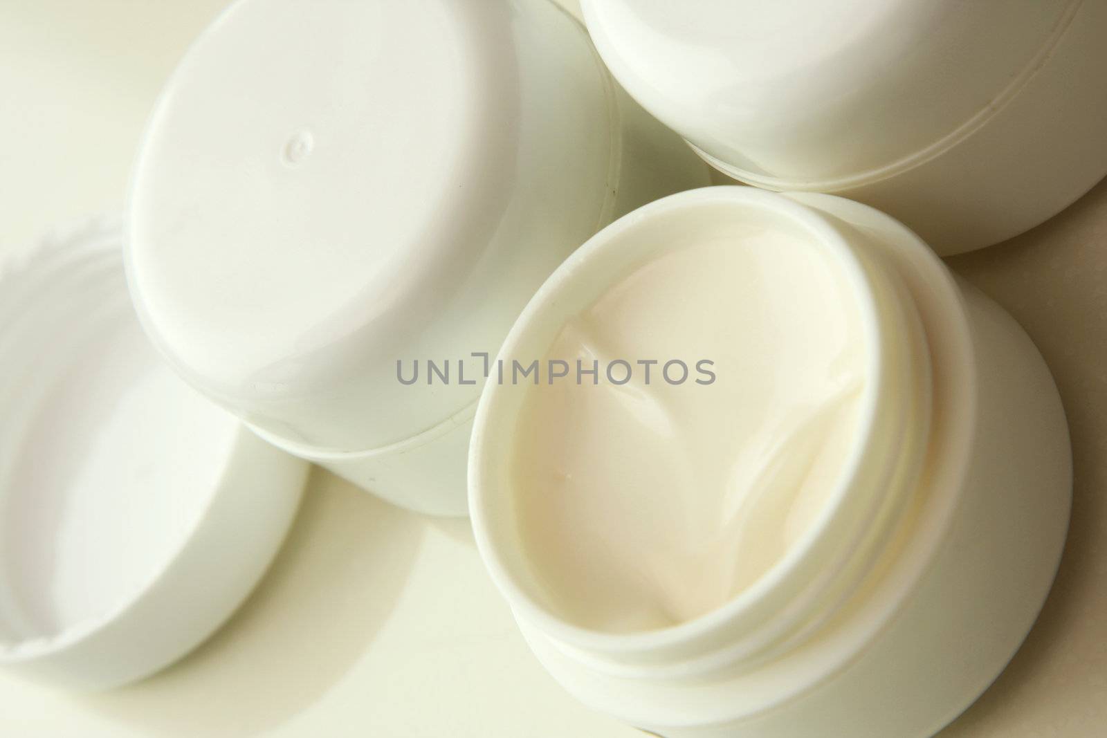 Jars of moisturizer cream concept for beauty products and cosmetics.
