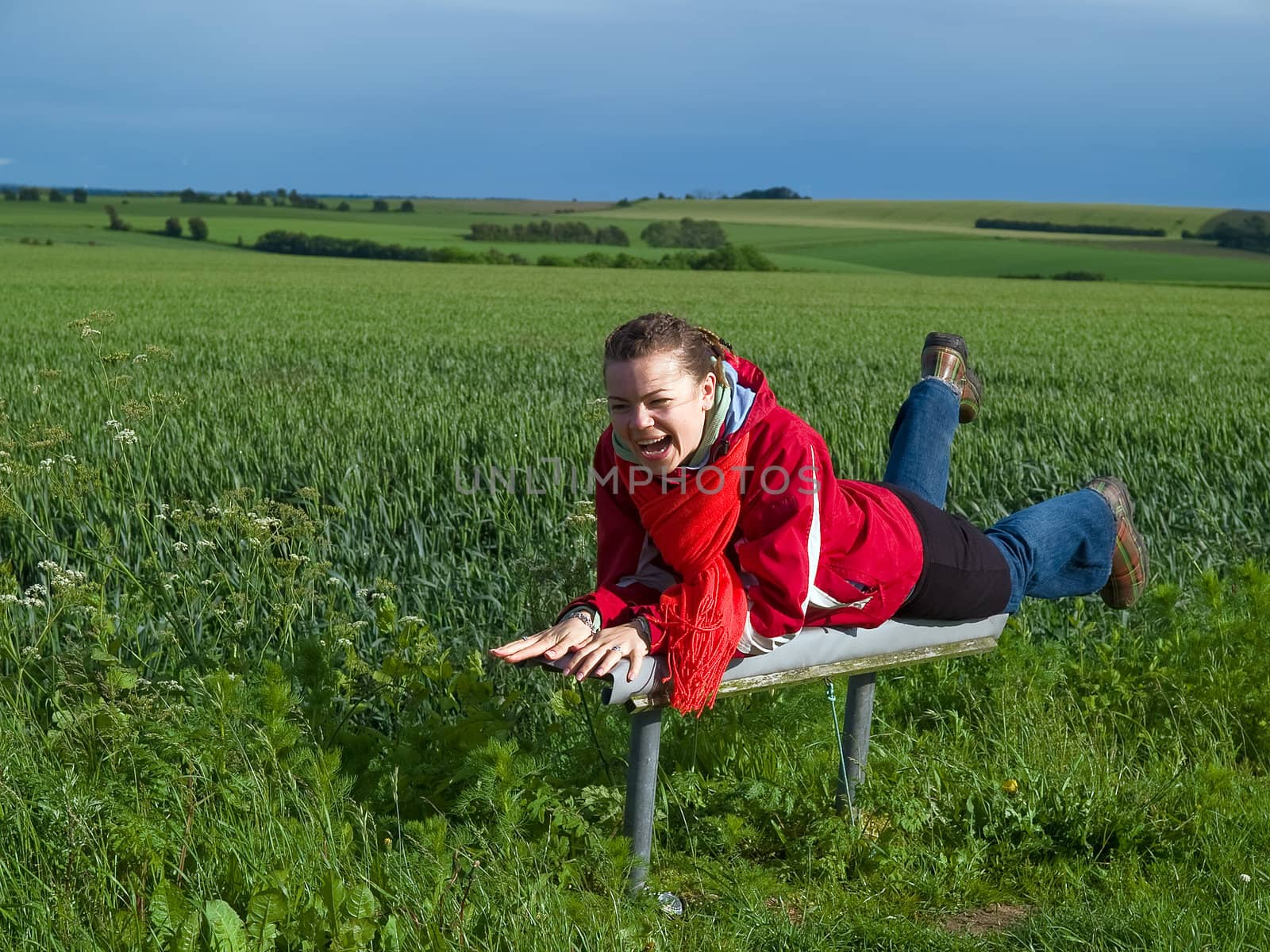 Beautiful attractive smiling young happy woman girl in a green wheat field