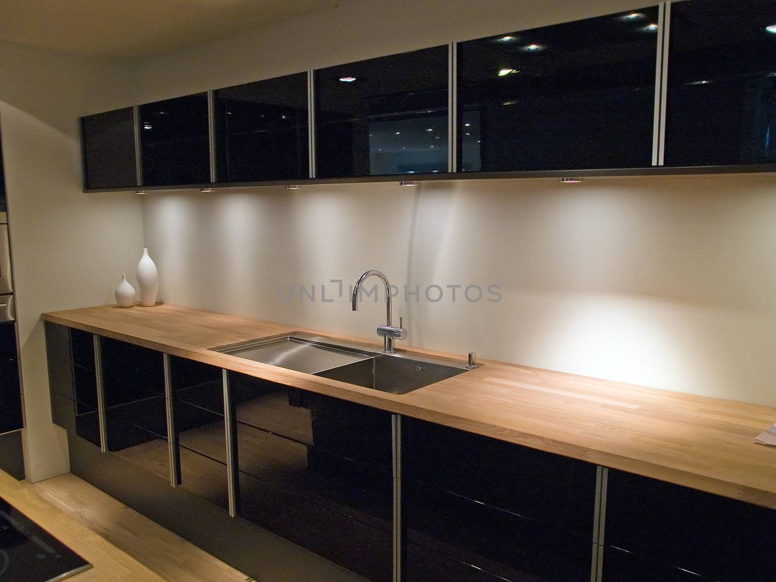 Modern clean design trendy kitchen with black wooden elements 