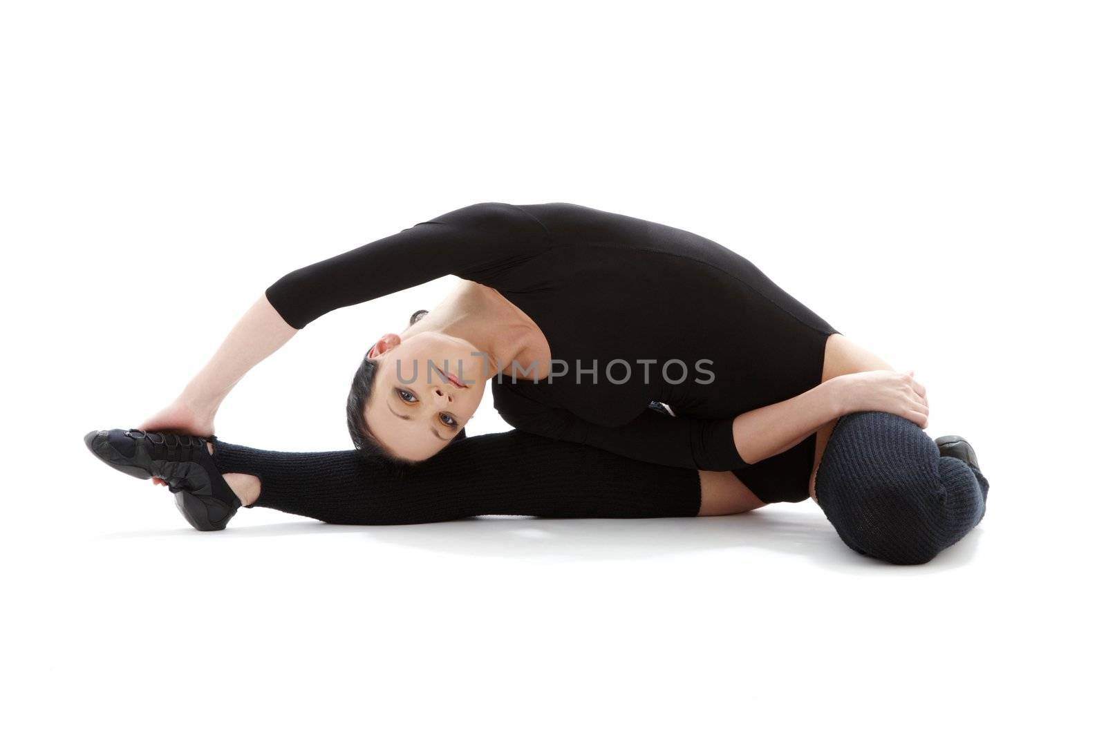 lovely girl in black leotard working out over white