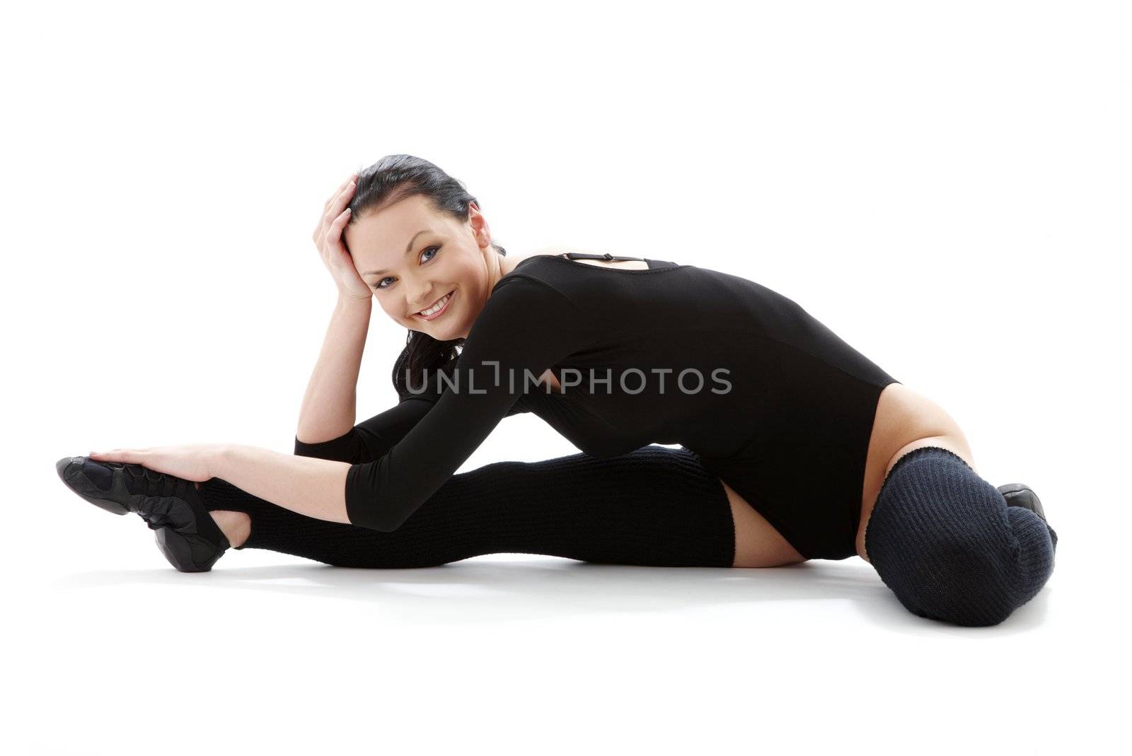 lovely girl in black leotard working out over white