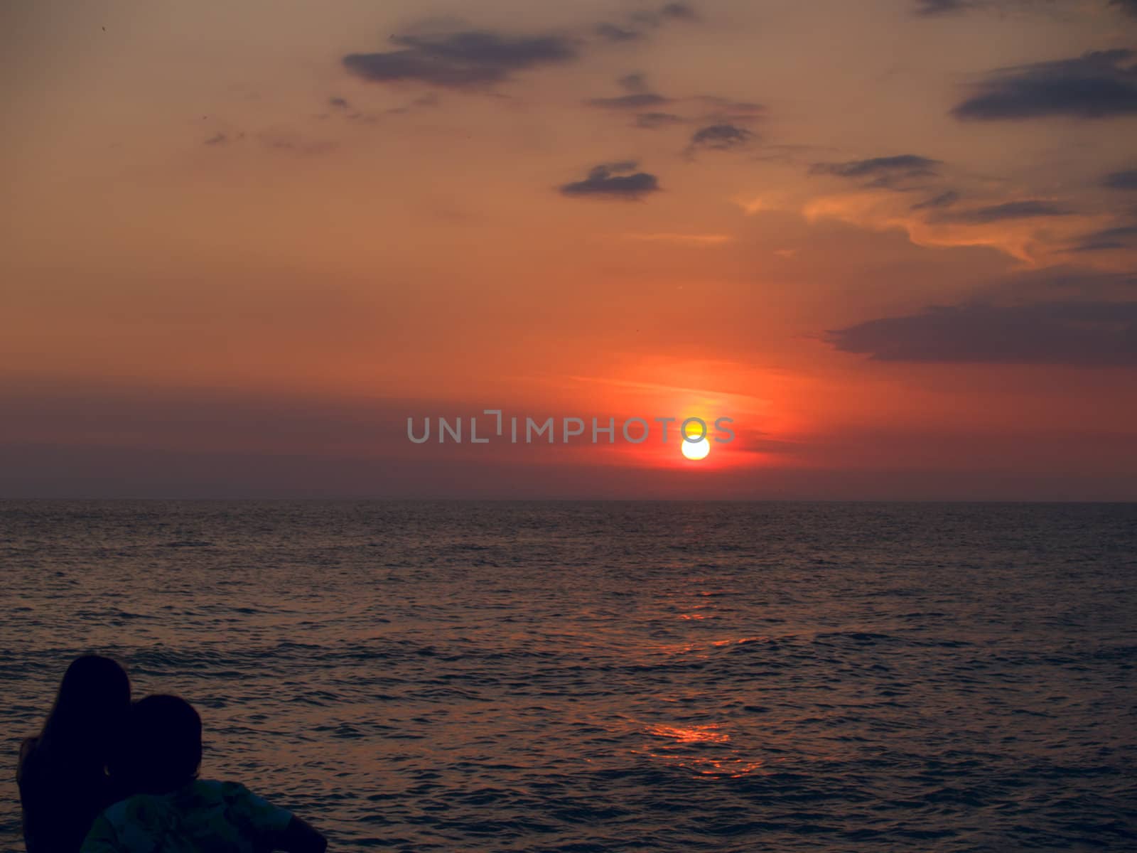 Couple on a sea beach by liseykina