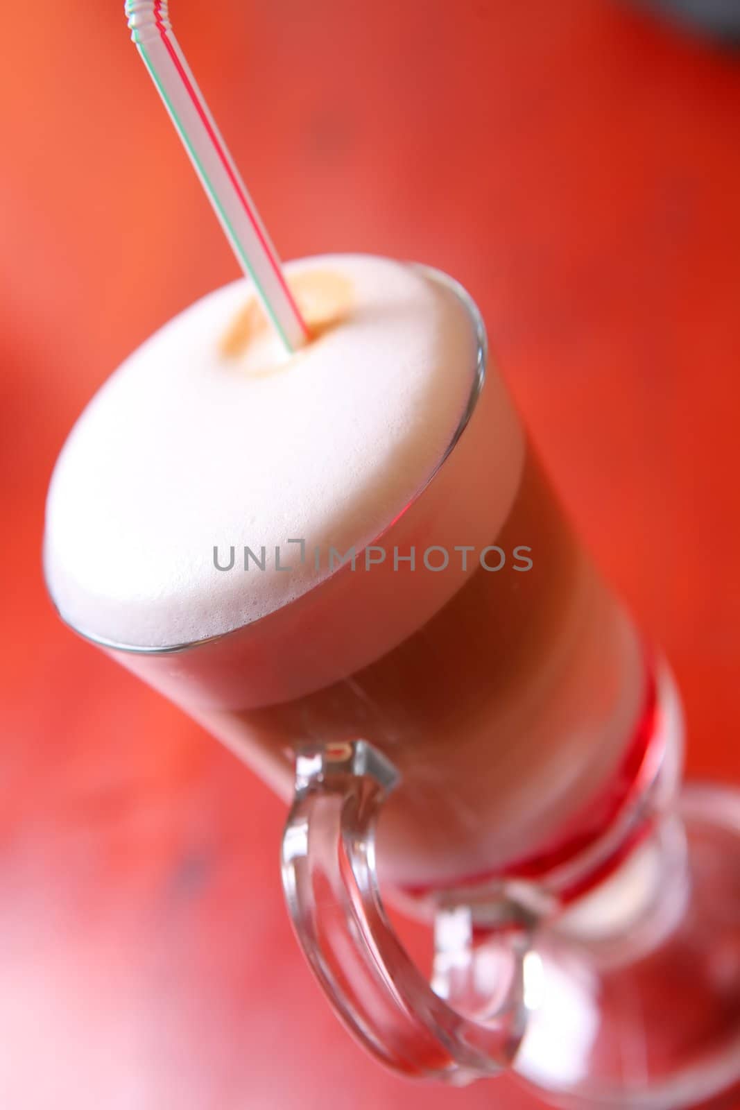 Coffee Drink with Straw on Red Table