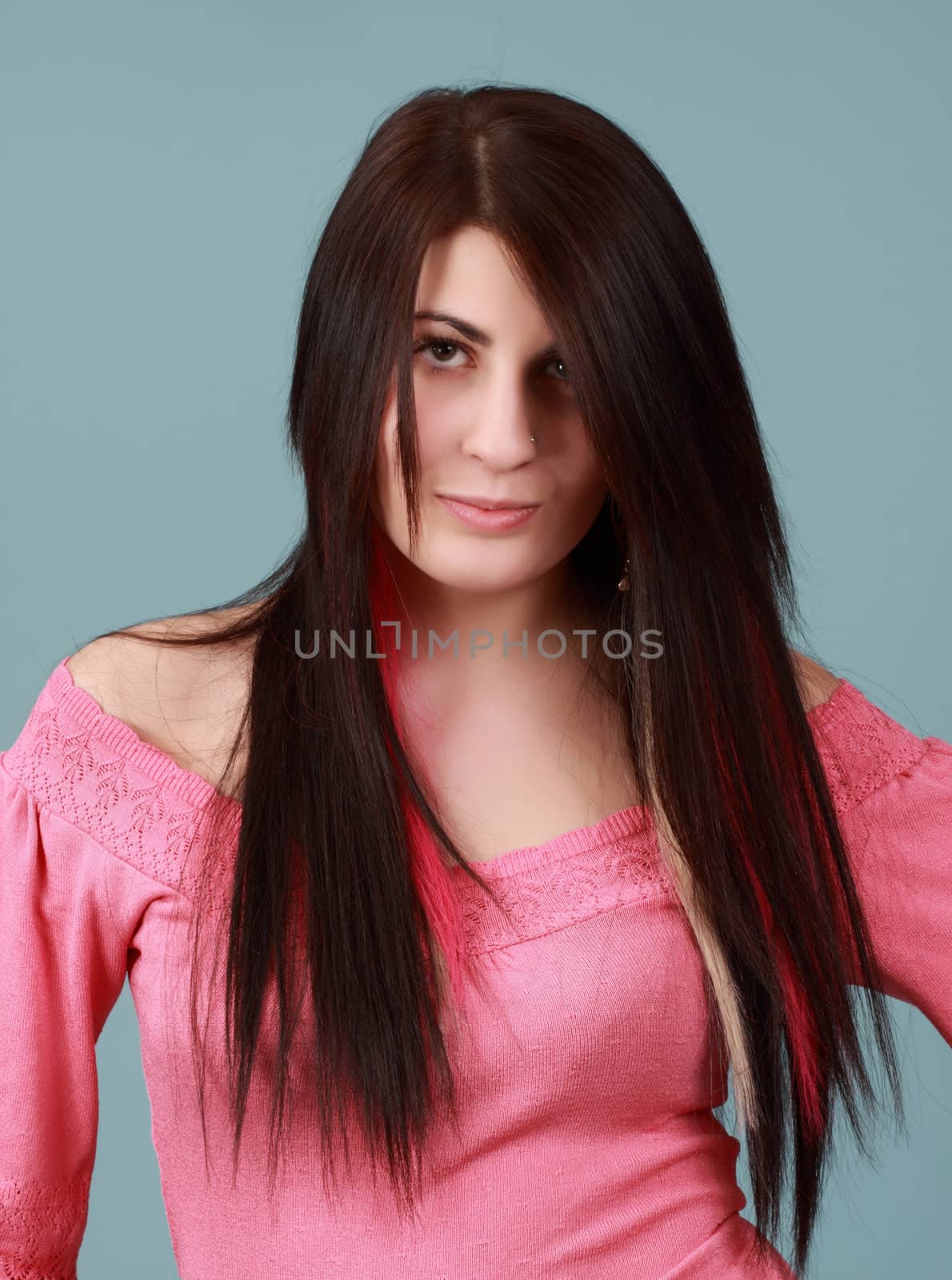 caucasian girl with long hair, blue background