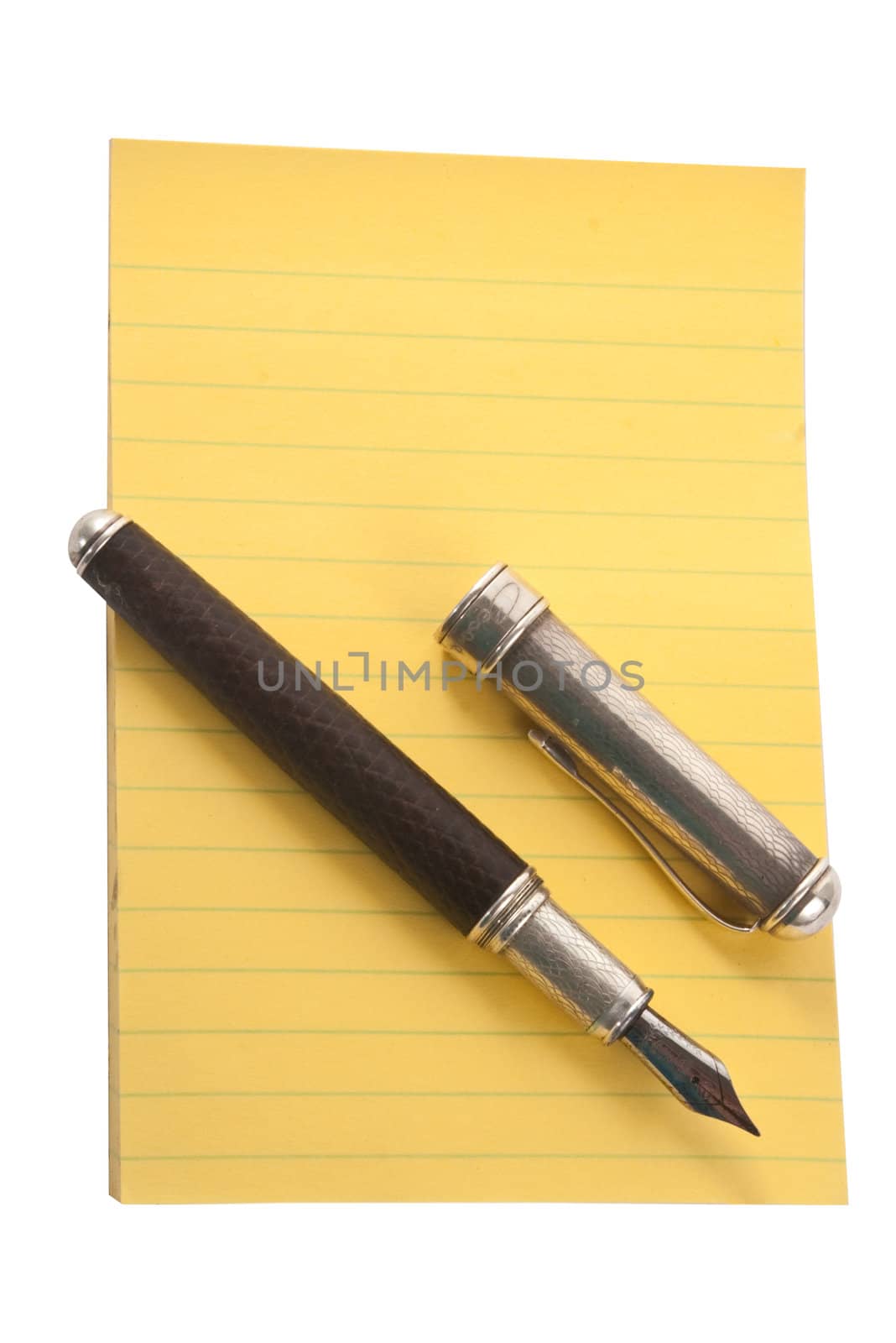 Yellow notepad with fountain pen, isolated on white background