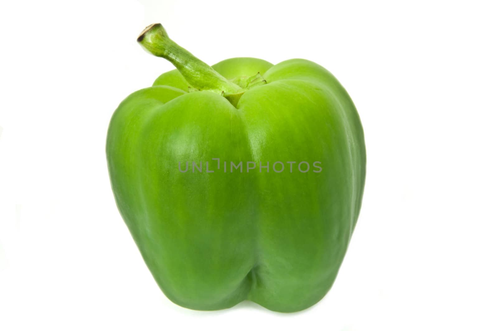 Single green isolated bell pepper arranged over white.
