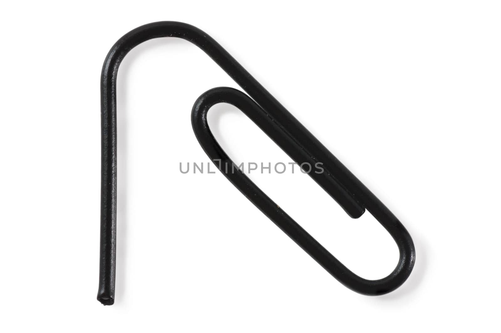 Macro view of black paper clip isolated over white