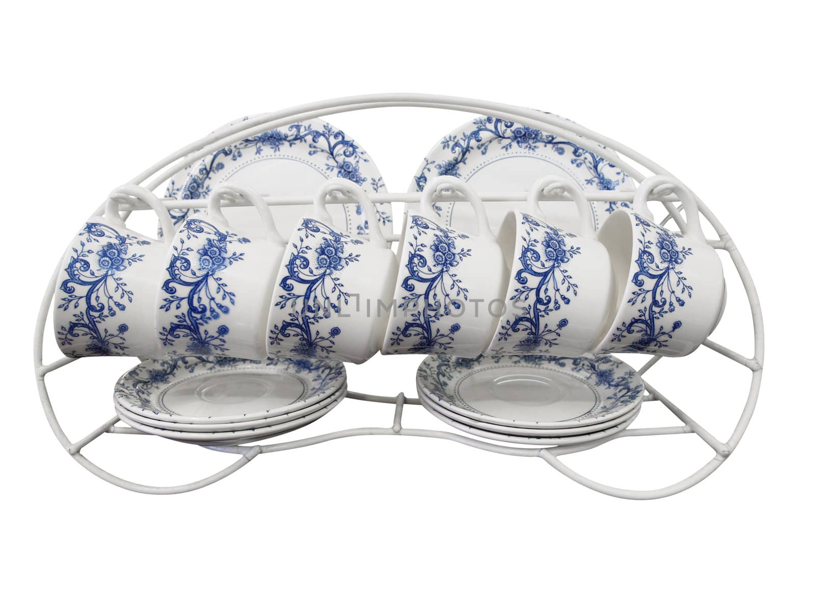 Six Place Set of Cups Plates and Saucers on a Rack isolated with clipping path           