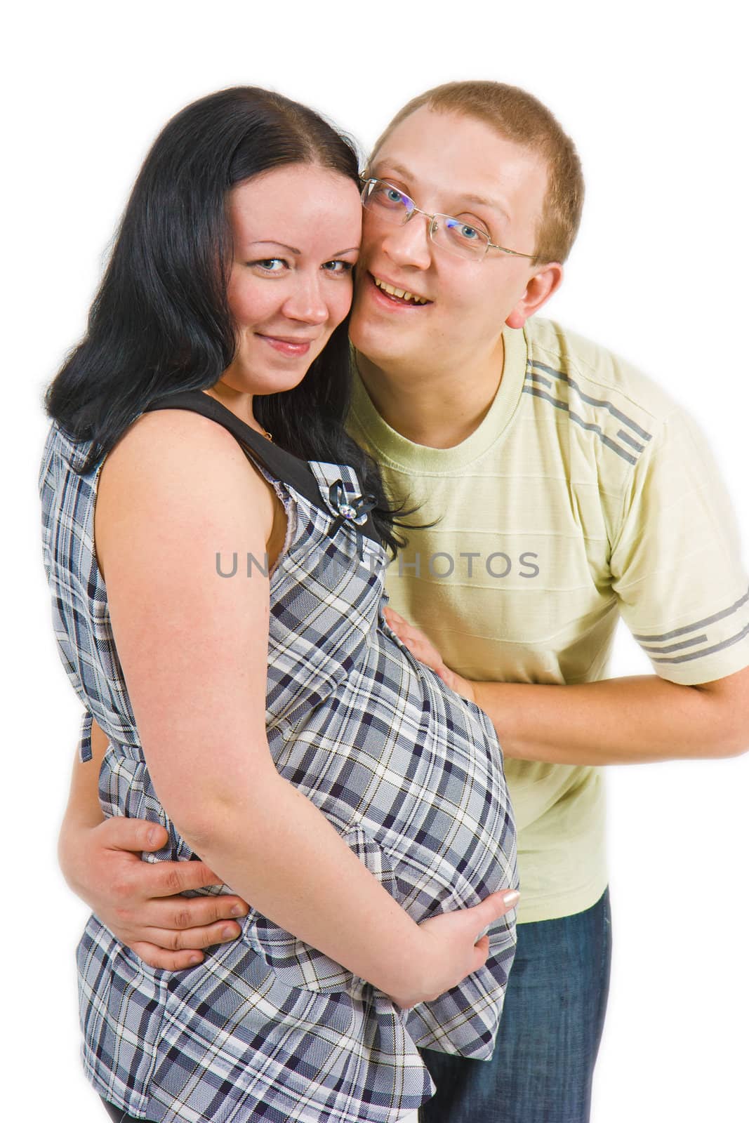 young couple awaiting the birth of a child on a white background