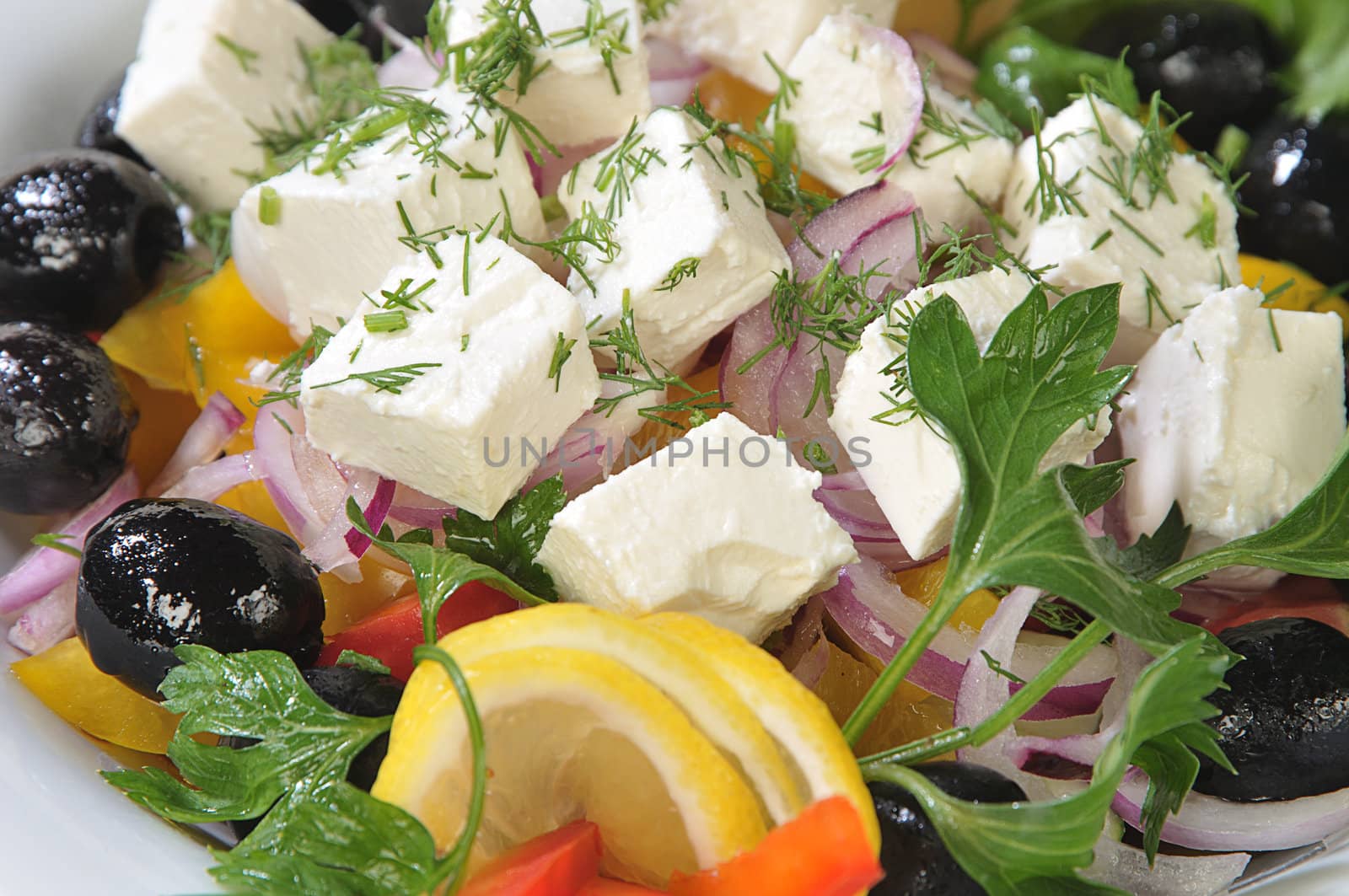 Close-up slices of cheese in a salad by dyoma