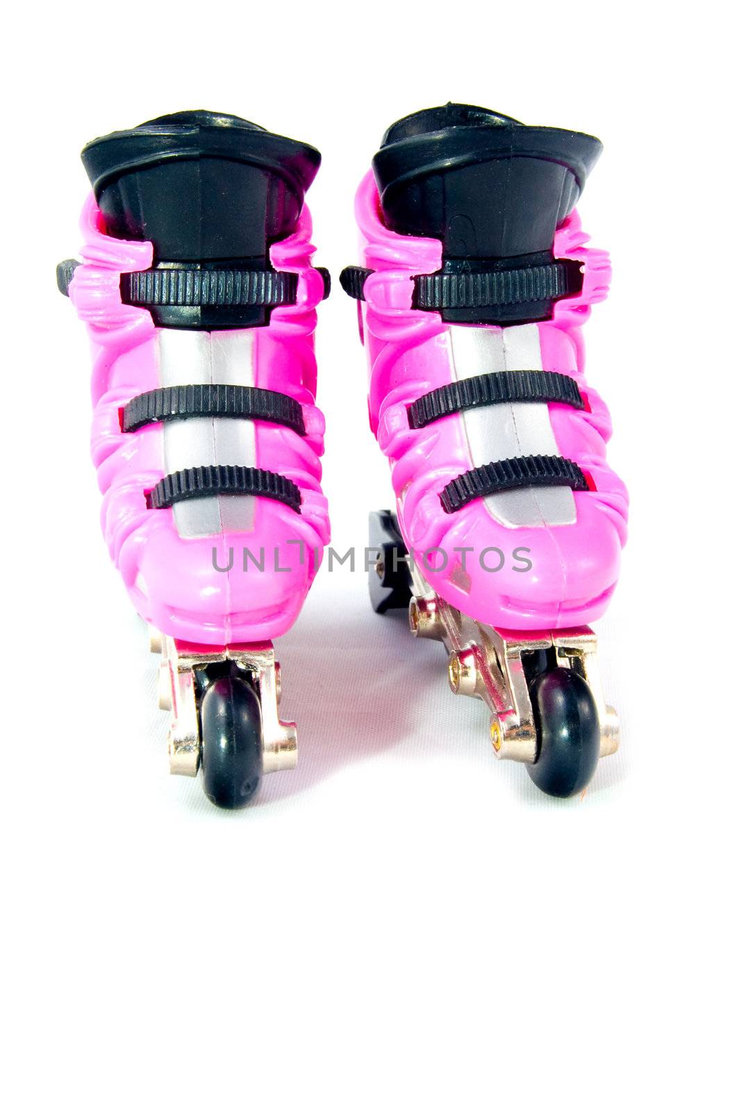 font view of two pink rollerscates isolated on a white background