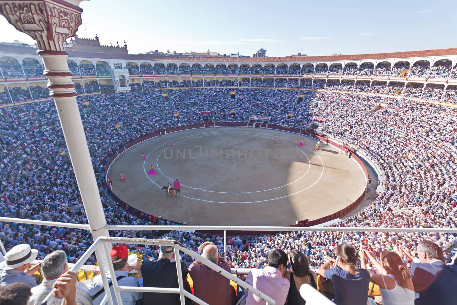 Madrid - OCTOBER 1: The huge crowd jammed in the famous Plaza de Toros are watching the bullfight on OCTOBER 1, 2010 in Madrid. Spain.