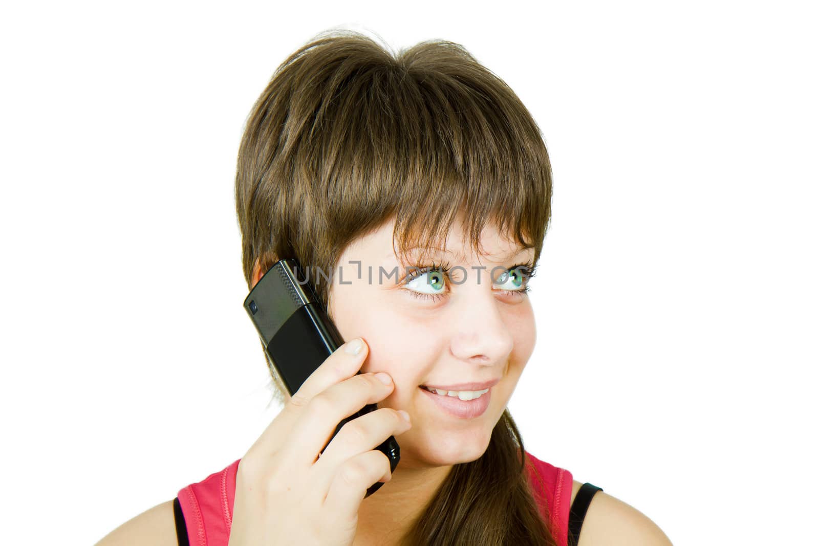 smiling beautiful girl with a phone on an isolated white background
