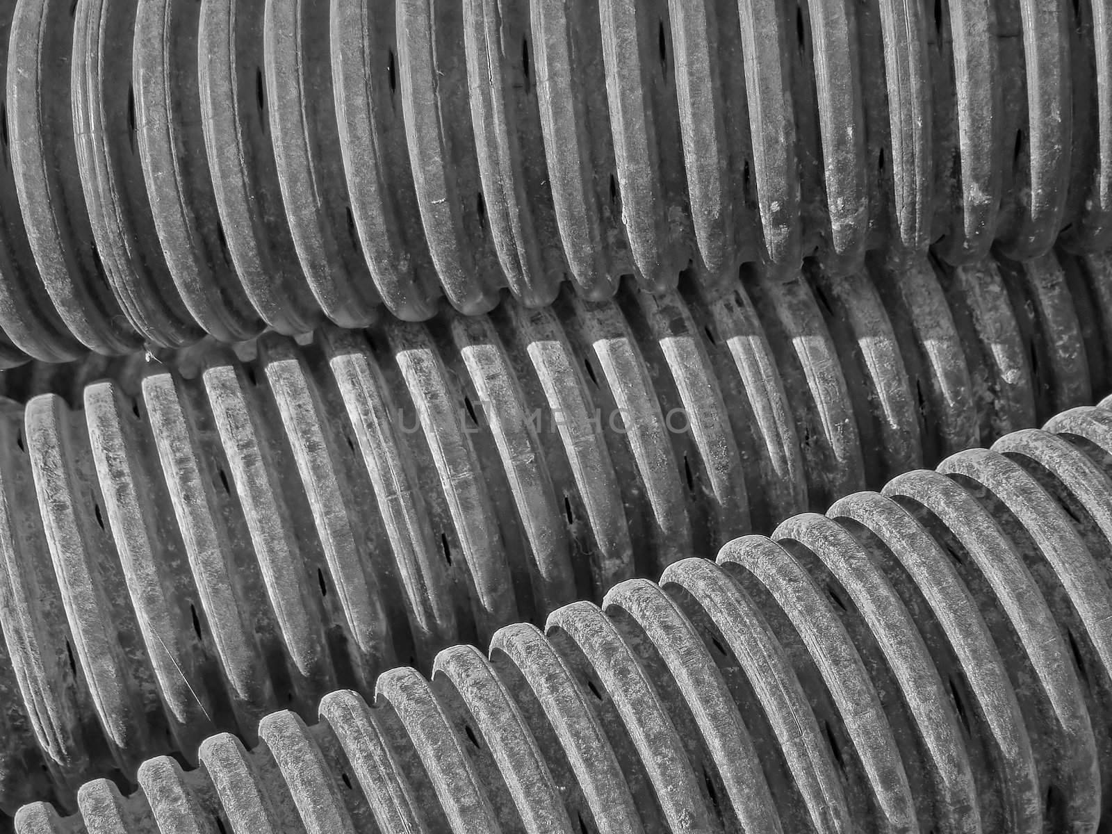 close-up of plastic drain in black and white for more dramatic geometrical effects, great background and texture.