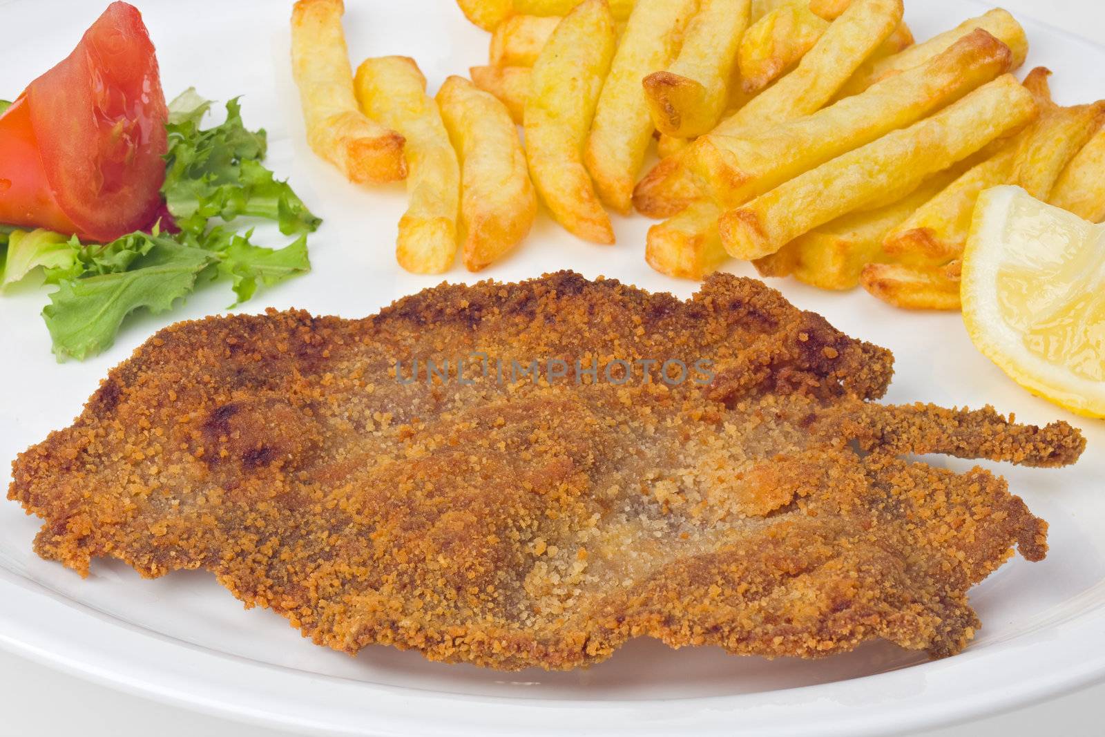 detail of a viennese schnitzel on a plate