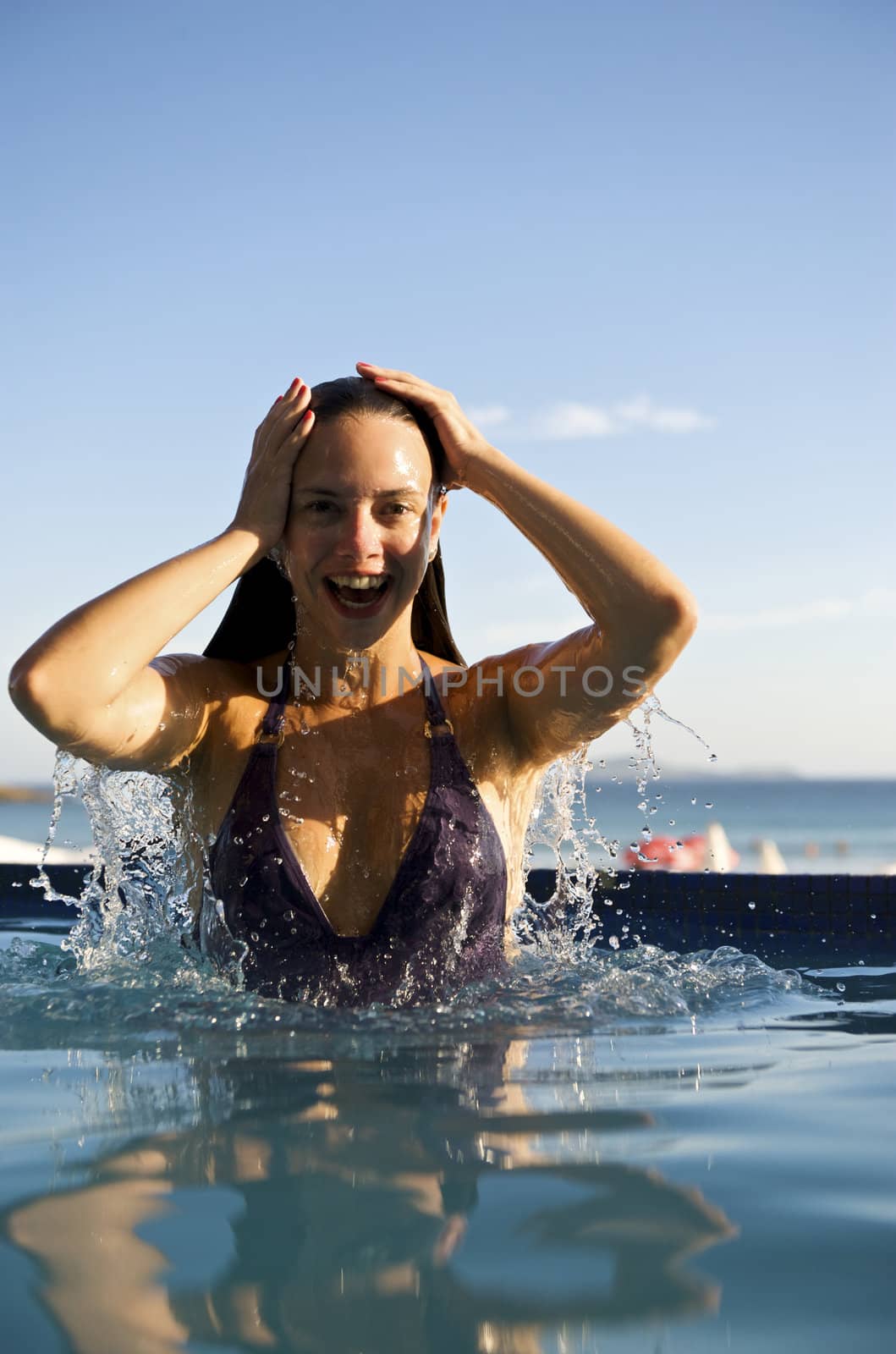 Woman enjoying the swimming pool in Buzios, rio de Janeiro, Brazil