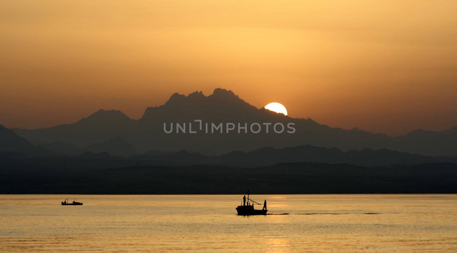 Egypt sunset sea boat sun mountains