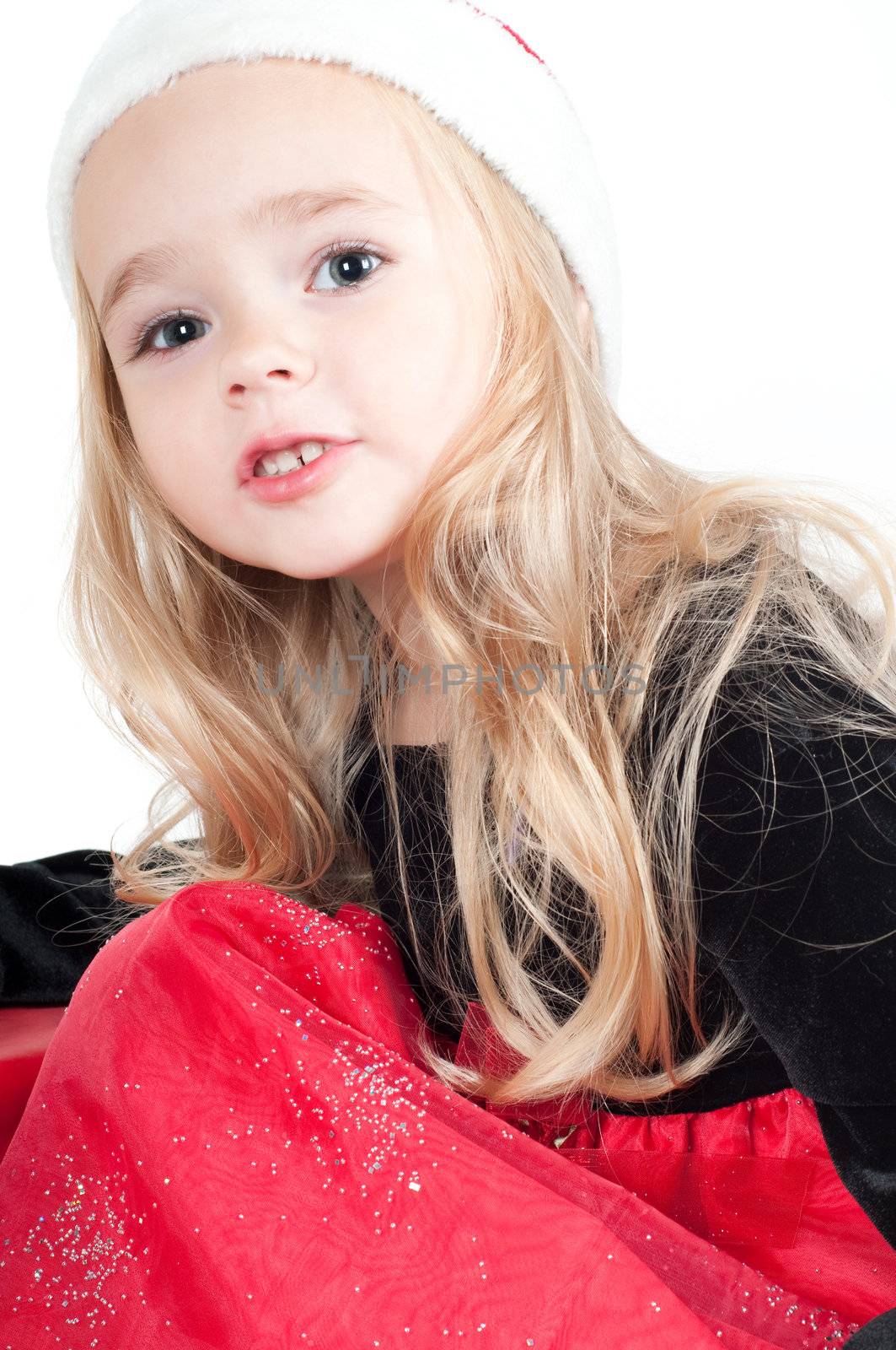 Beautiful baby girl dressed up for Christmas isolated in white