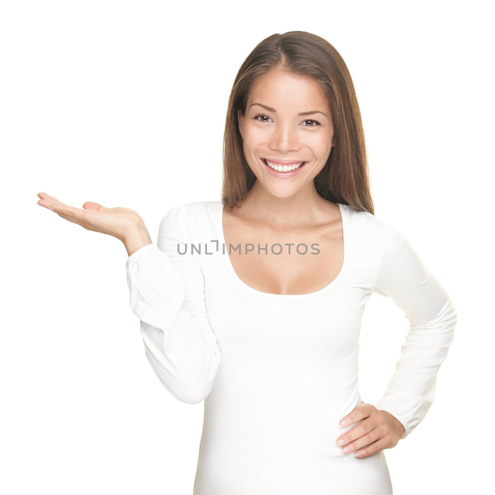 Smiling woman showing copy space for product / message isolated on white background. Mixed race Chinese Asian / white Caucasian female model.