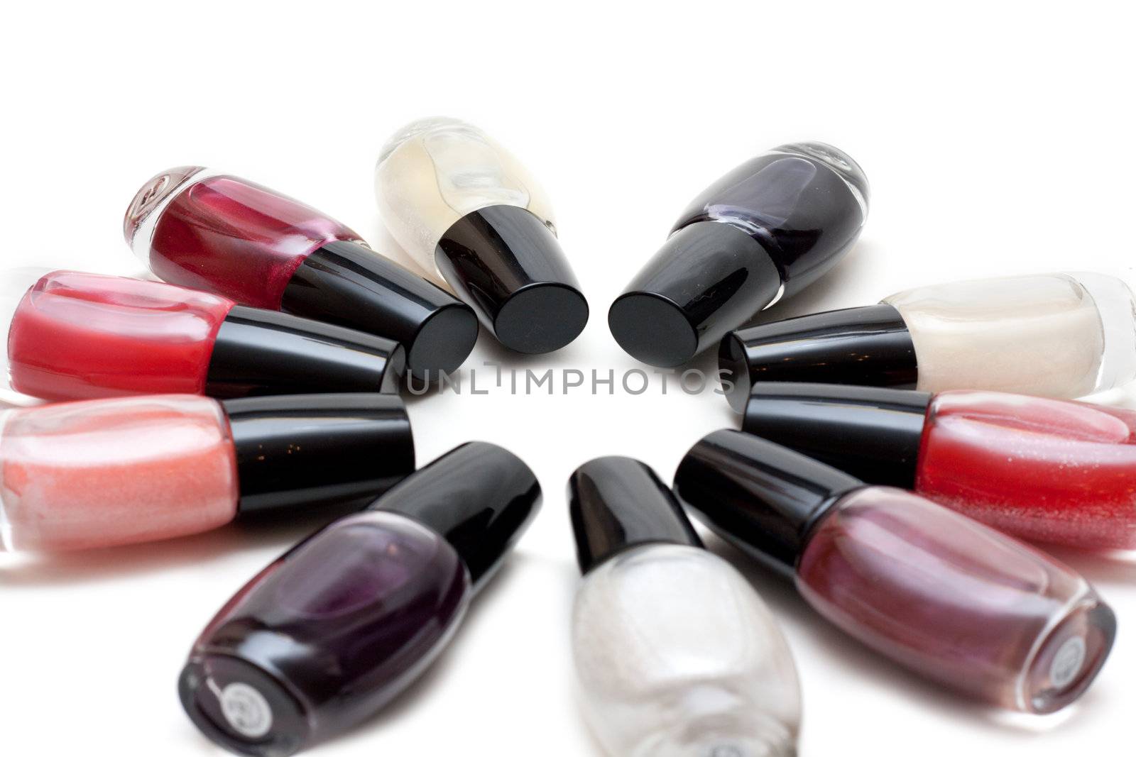 Vials colour varnish nailwaer, make-up insulated on white background