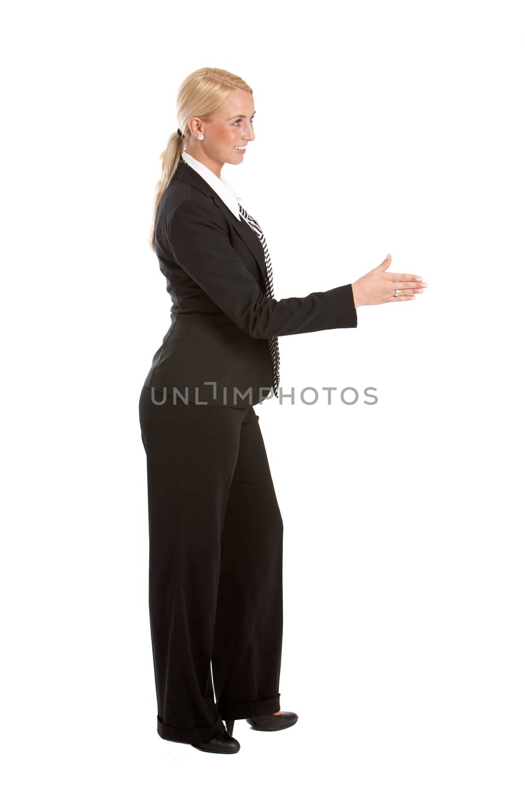 Pretty blond business woman extending her hand in welcome