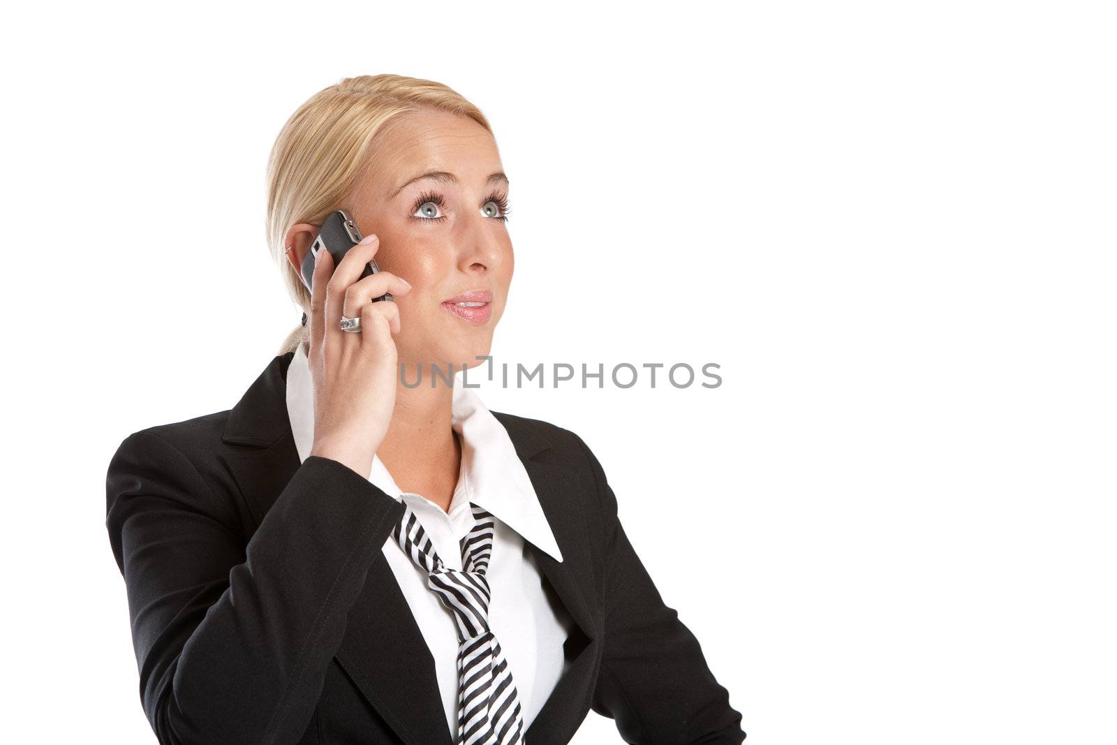 Business woman on the phone listening and looking curious