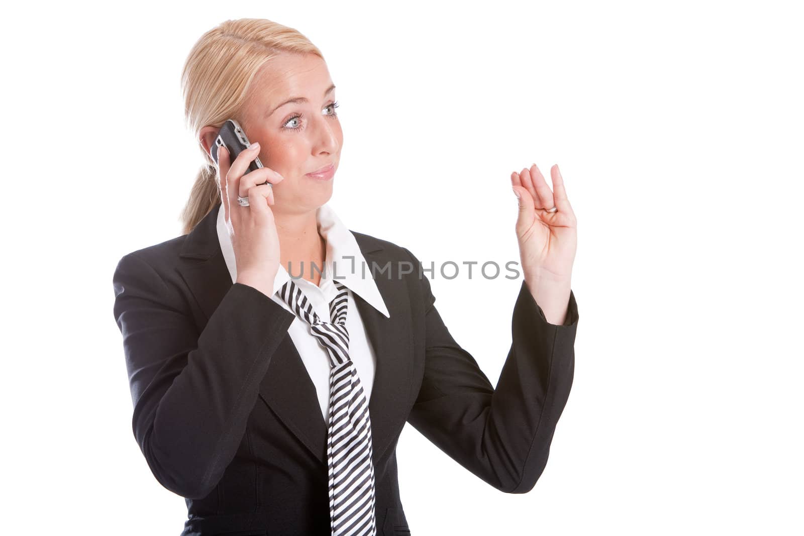 Businesswoman looking very unconvinced while talking on the phone
