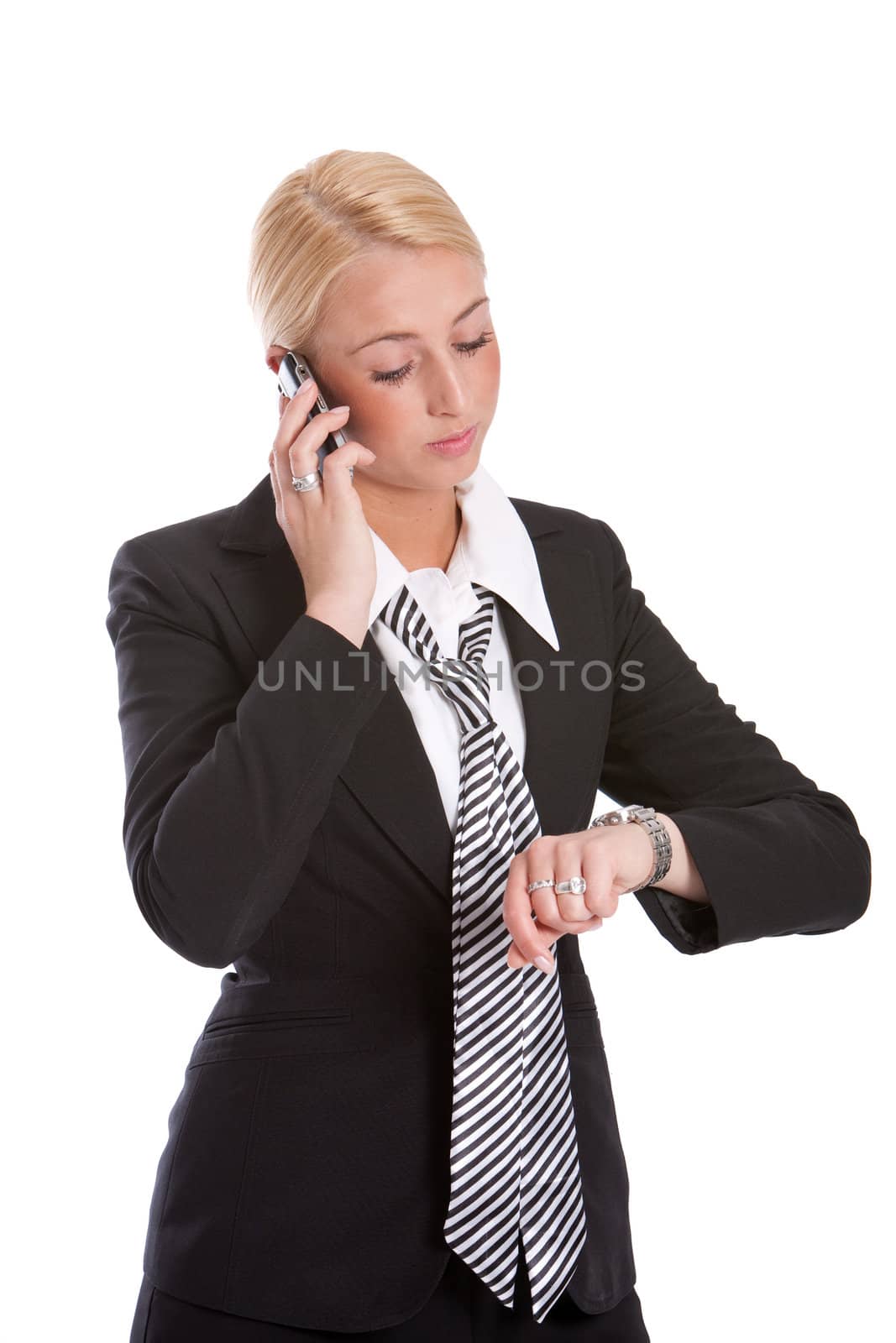 Beautiful businesswoman standing and checking the time