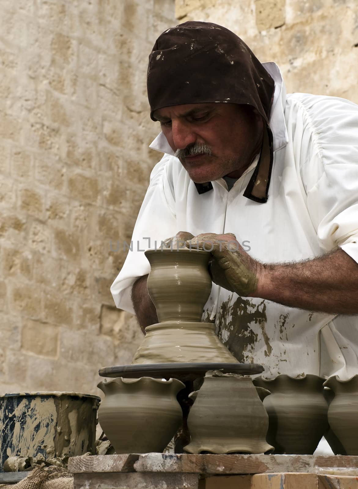 MDINA, MALTA - APR19 -  Potter using medieval tools in Mdina in Malta April 19, 2009