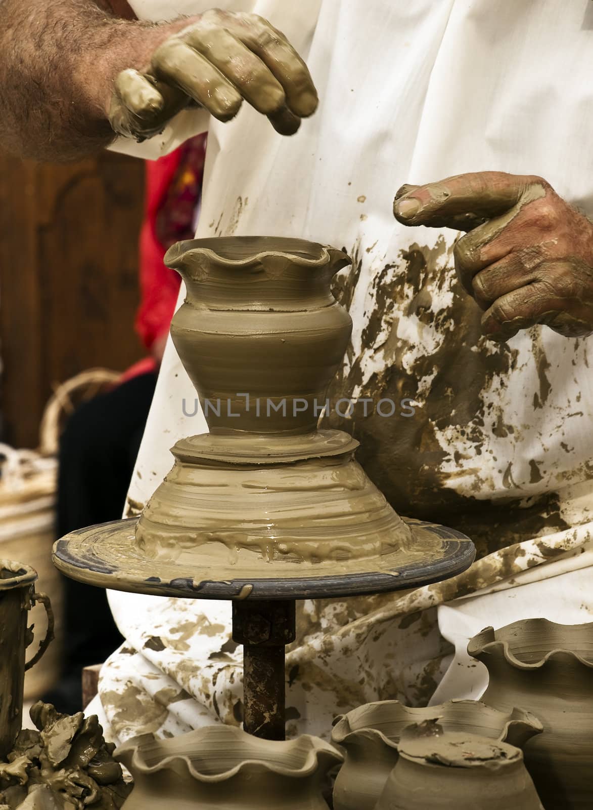 Detail of a pottery maker hands at work on clay pottery
