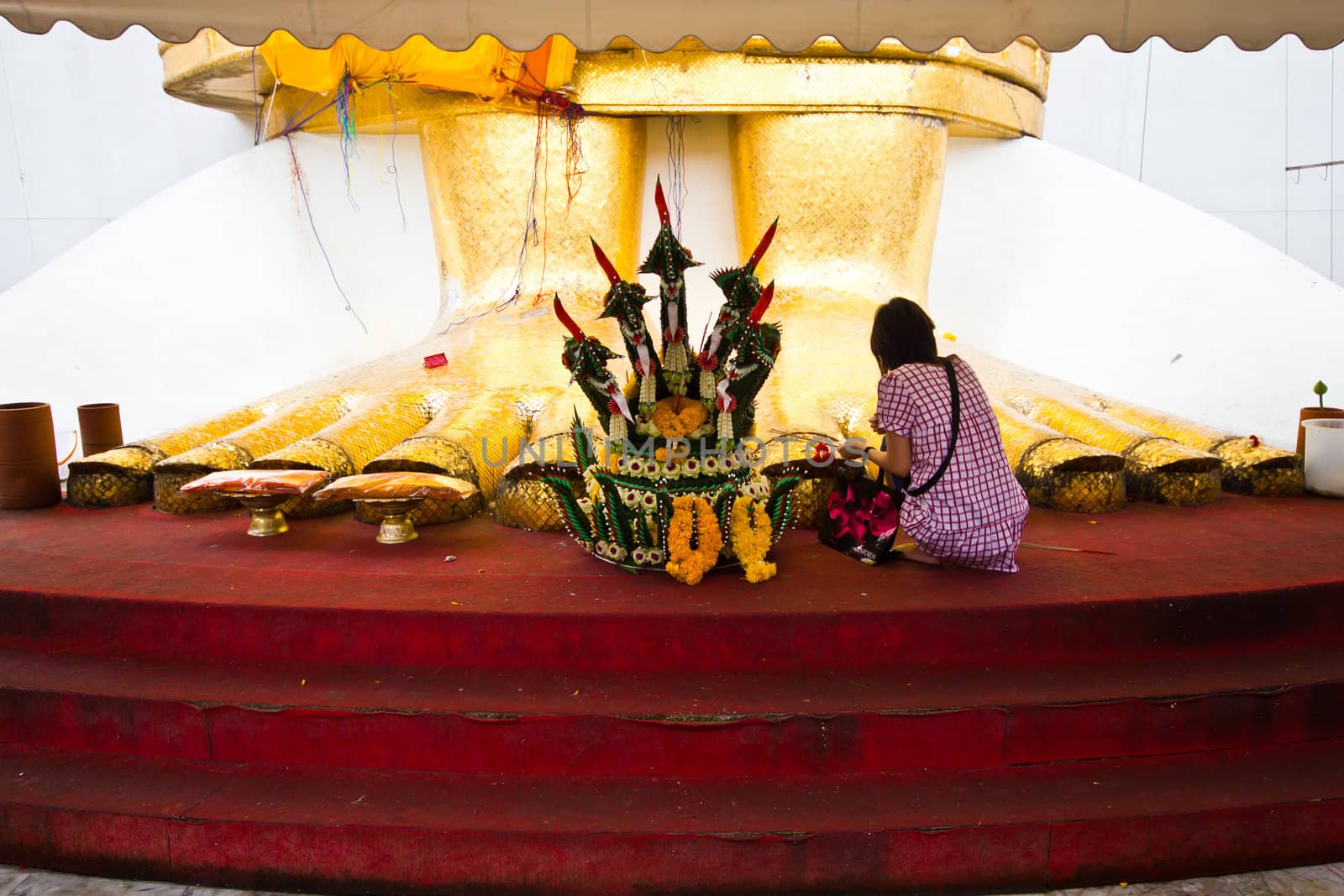 in front of big standing buddha foot by lavoview