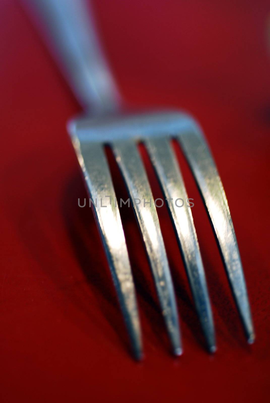 An isolated Shiny sharp Steel Dining fork 