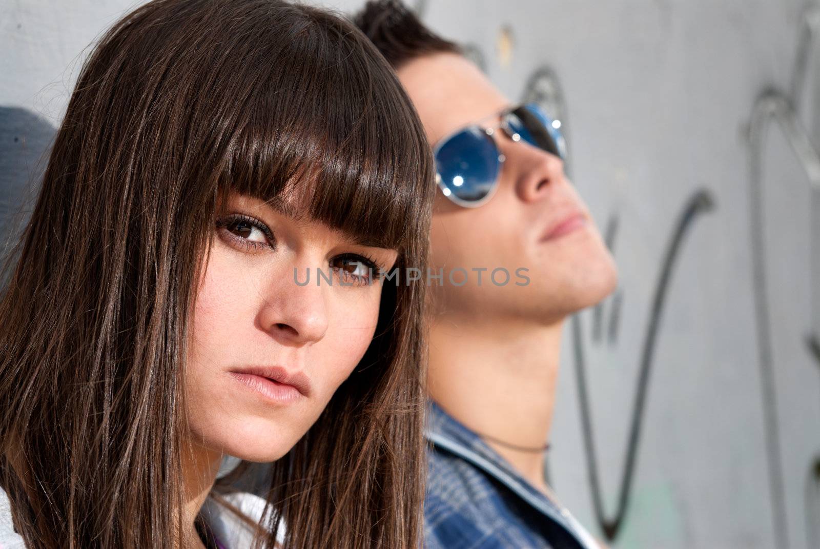 Young couple urban fashion close-up portrait focused on woman