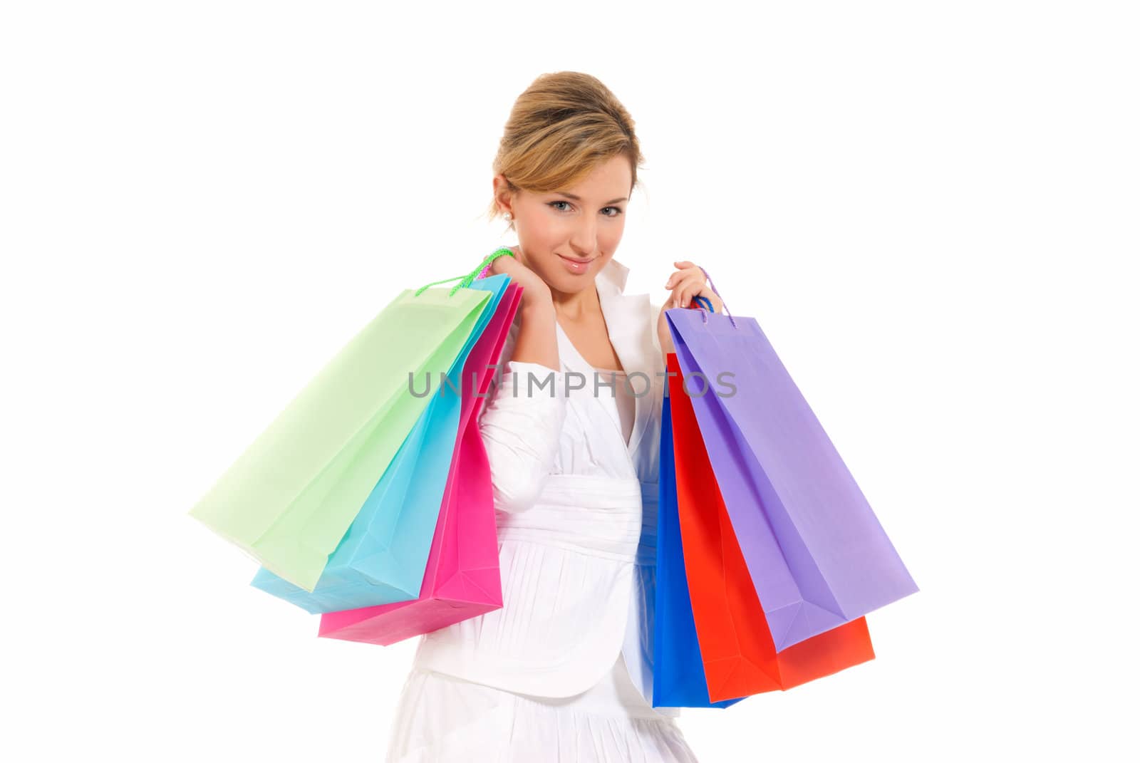Young woman with shopping bags standing isolated on white background