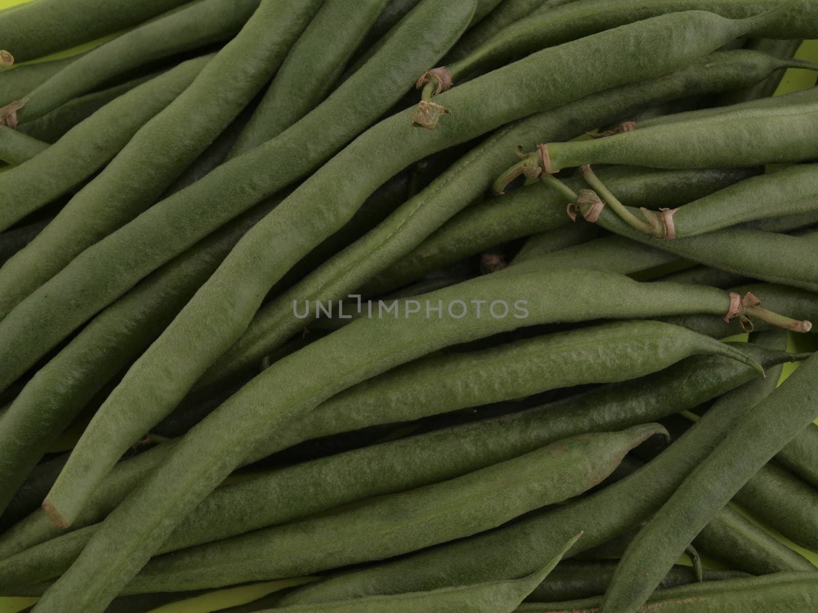 Green organic runner beans  with no background.