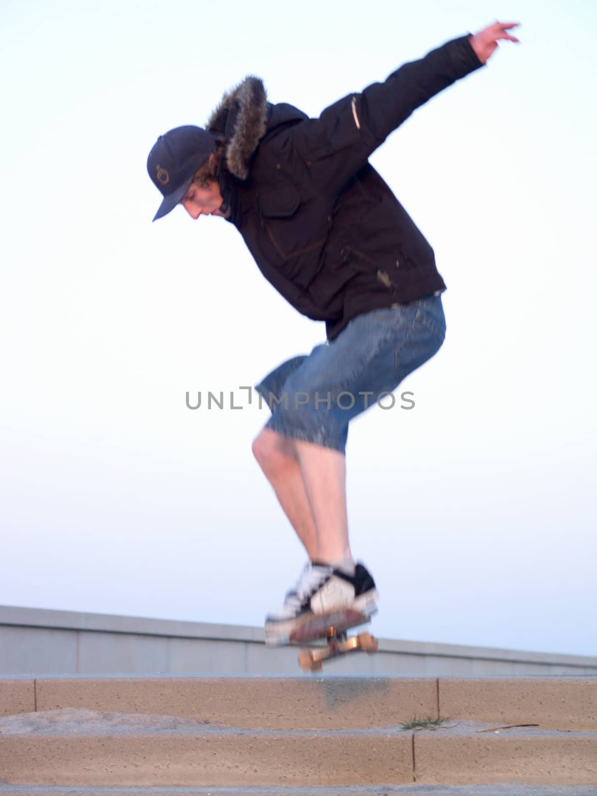 Awesome - Modern Teen doing a stunt on skate board in the city