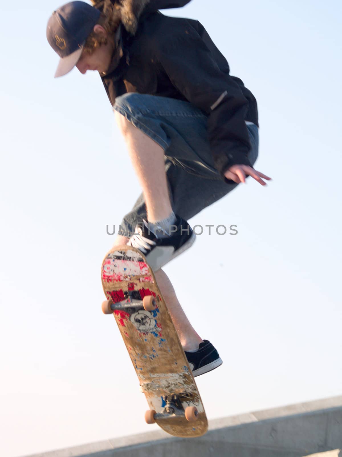 Young skateboarder getting some air on his skate board