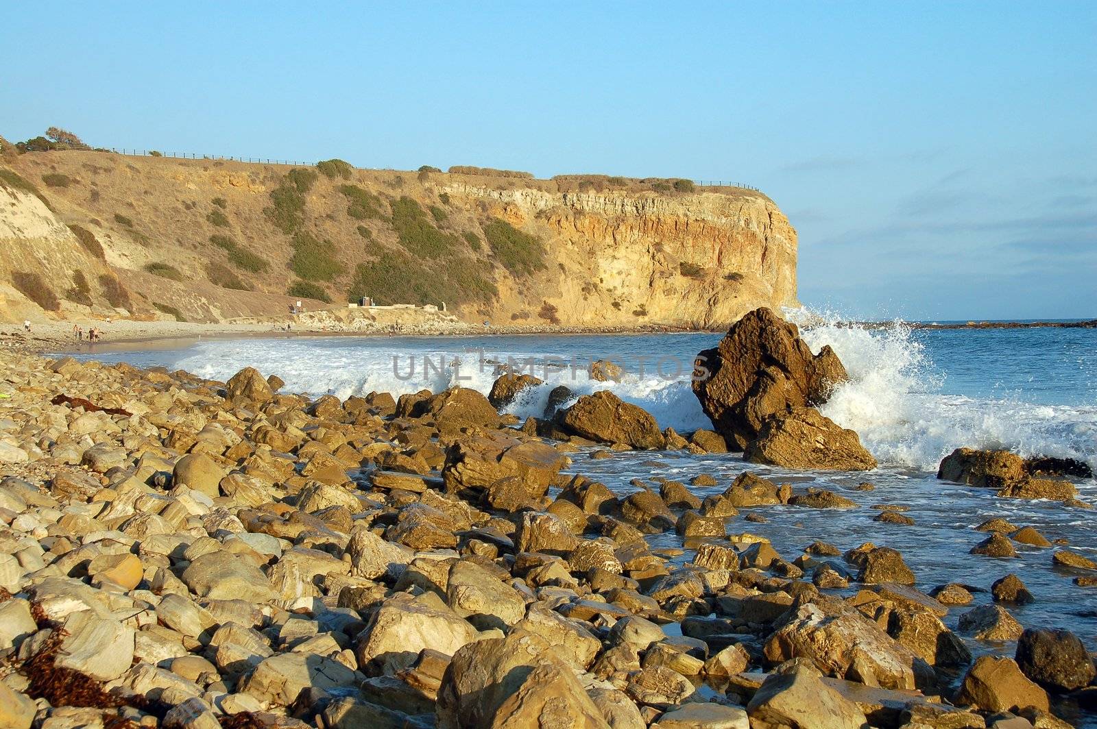Rocky california beach with waves splashing Water