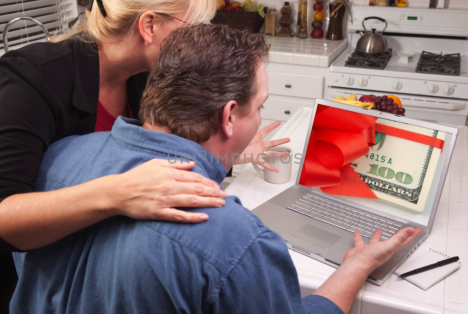 Couple In Kitchen Using Laptop - Money by Feverpitched