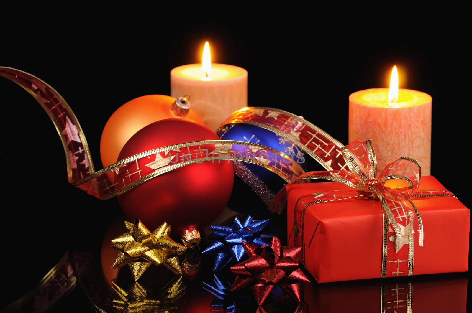 Christmas decoration with candles on a black background