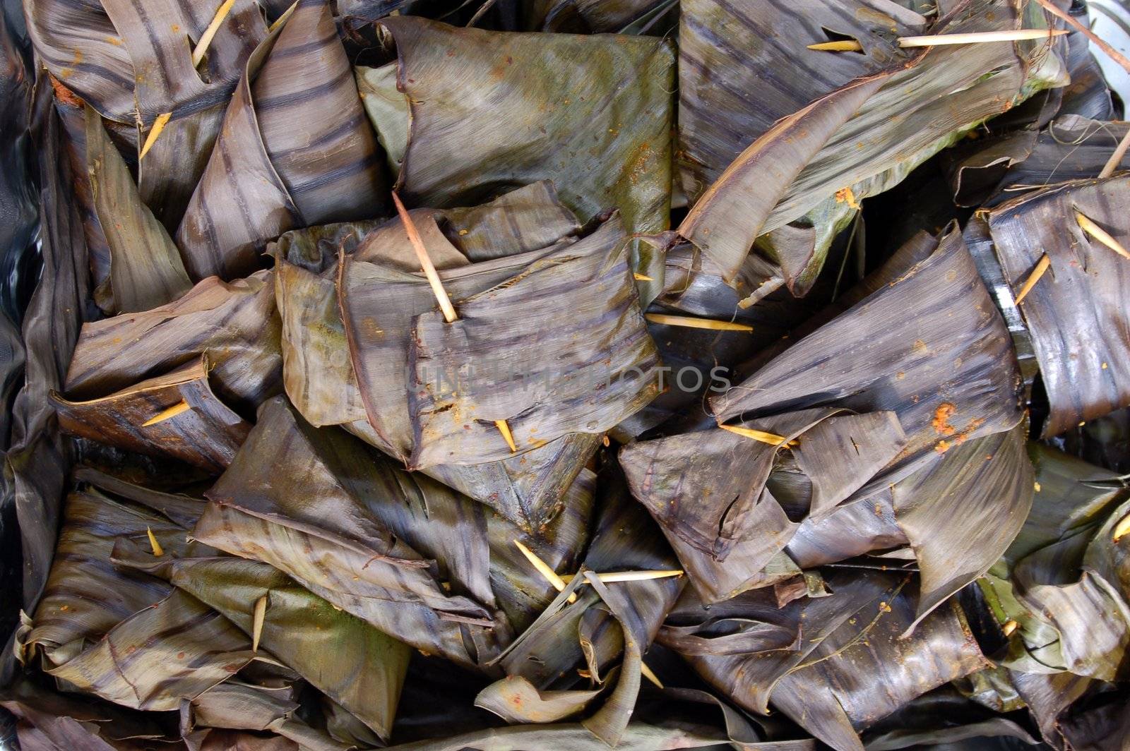 fish cooked in herbs and spices and served in leaf wraps